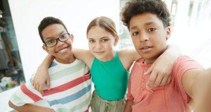 Boy in Blue and White Striped Tank Top Beside Boy in Pink Polo Shirt