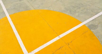 Gray Concrete Pavement With Yellow and White Paint