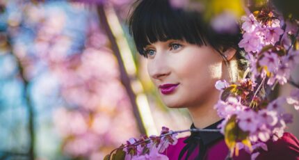 Close-Up Photography of Woman Near Flowers