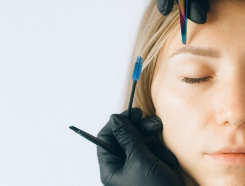 Woman in Black Leather Jacket Wearing Black Headphones